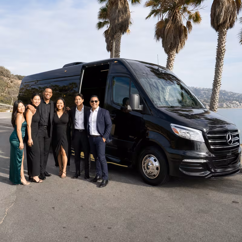 Group beside a Mercedes Sprinter limo from the Los Angeles fleet