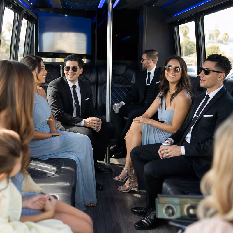 Wedding guests seated inside a Los Angeles party bus