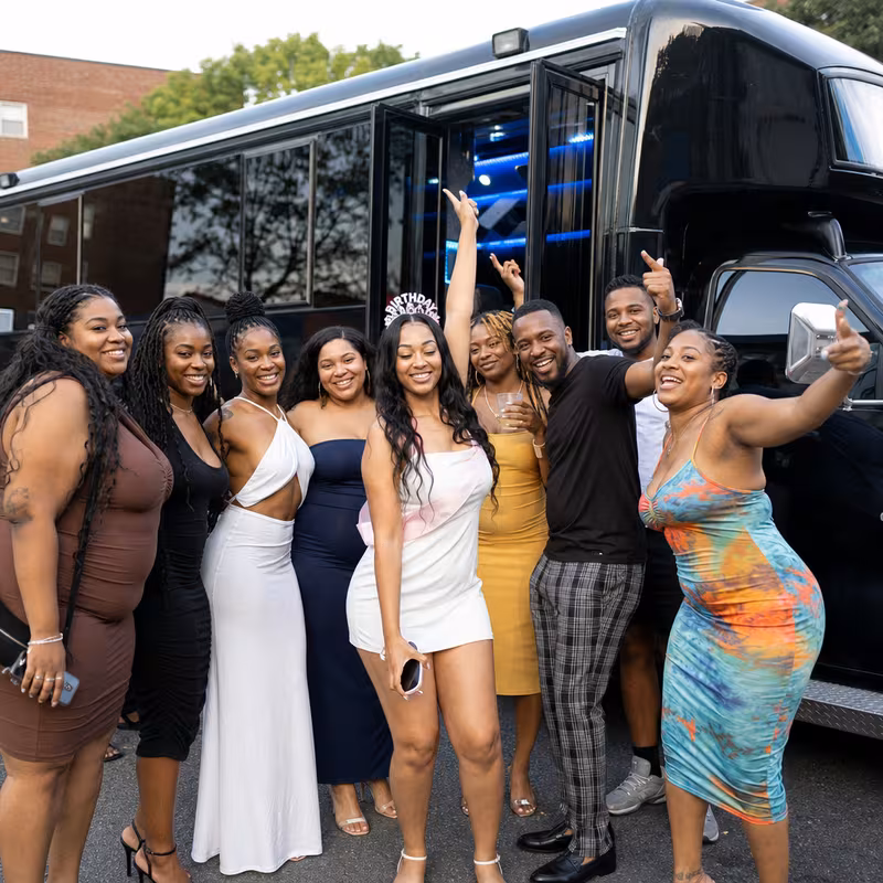 Party bus interior with wraparound leather seating and LED lighting in Los Angeles
