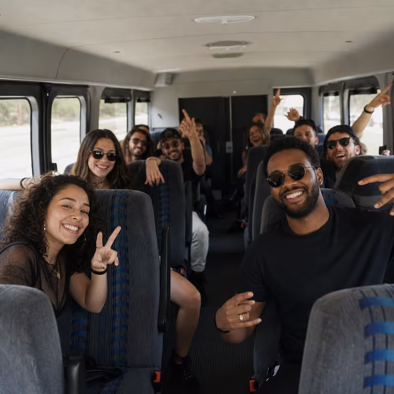 Party bus interior with wraparound leather seating and LED lighting in Los Angeles