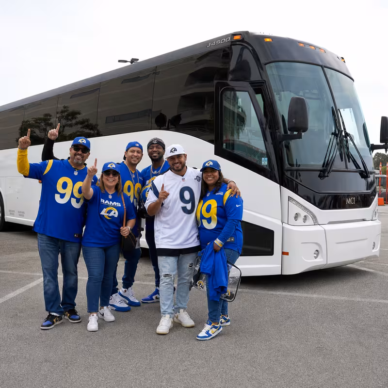 Passengers loading luggage while boarding an Los Angeles group shuttle