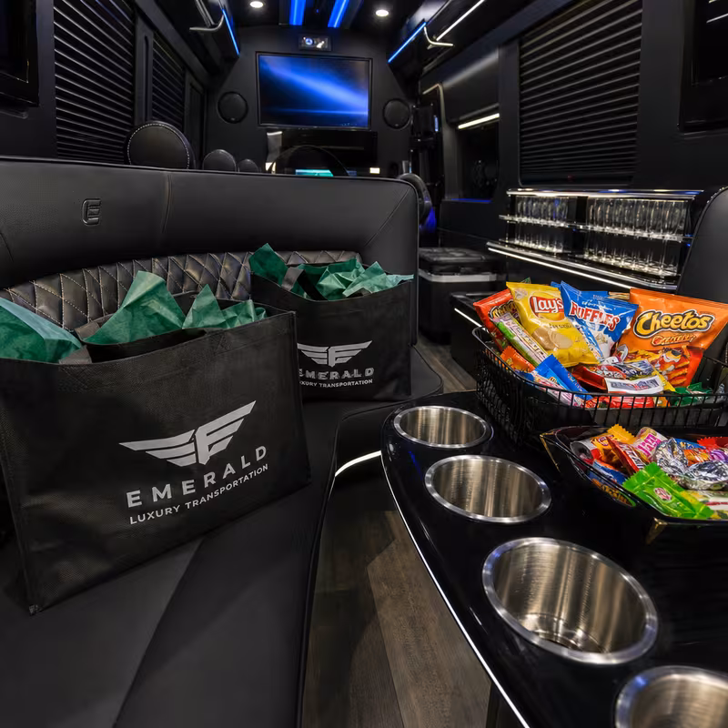 Party bus interior with wraparound leather seating and LED lighting in Los Angeles