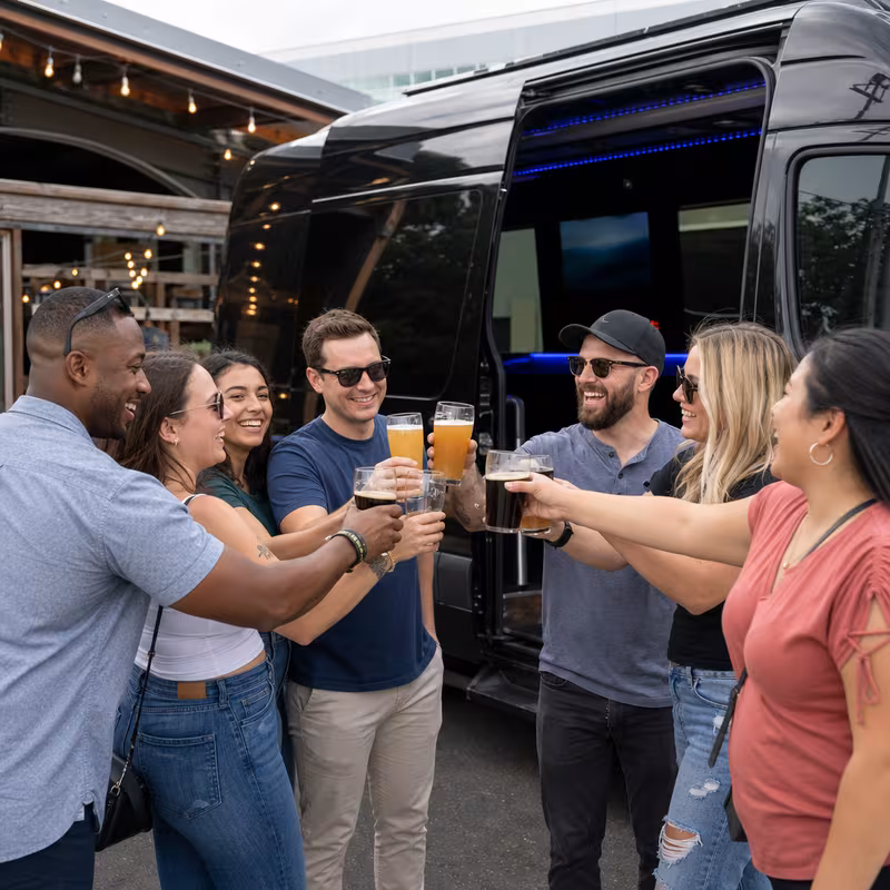 Passengers loading luggage while boarding an Los Angeles group shuttle